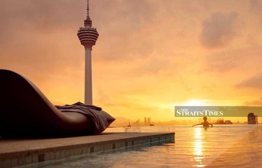 Admire the city skyline from EQ's infinity pool. Pictures by David Bowden.