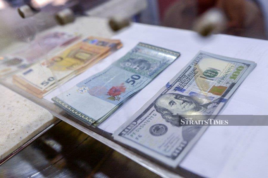 The ringgit’s performance against the US dollar is something would-be travellers should monitor, even if your destination is Singapore, not the US. - NSTP file pic/AIZUDDIN SAAD