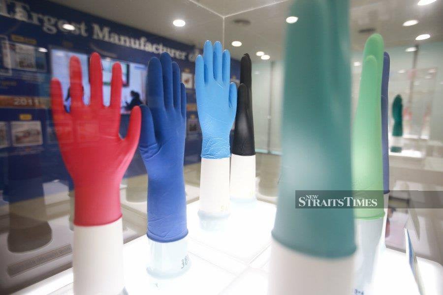 Top Glove said customers placed new orders following the depletion of excess inventory. STR/GENES GULITAH 