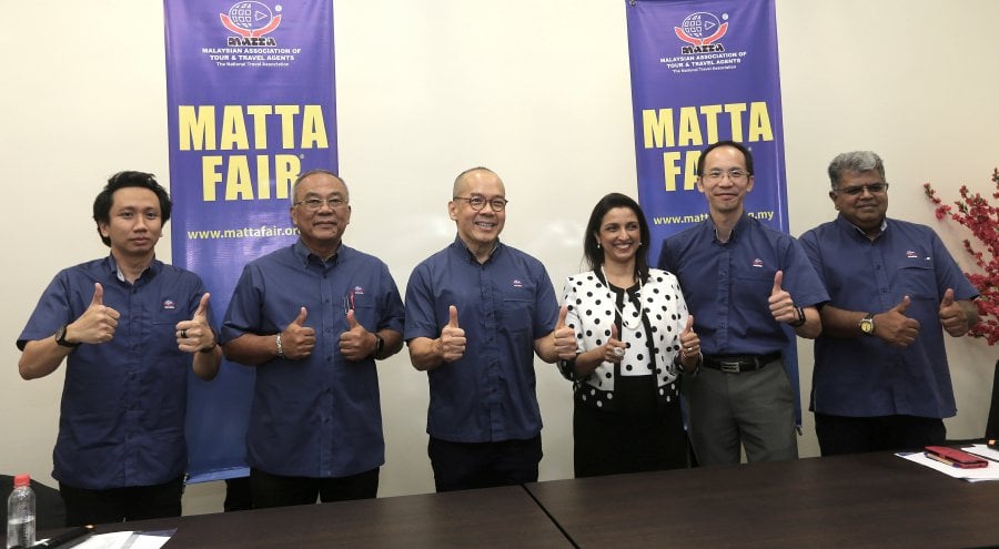 MATTA secretary general Nigel Wong (second from right) said this is double the sales secured during the MATTA Fair held in 2019 of RM210 million. STR/AMIRUDIN SAHIB.