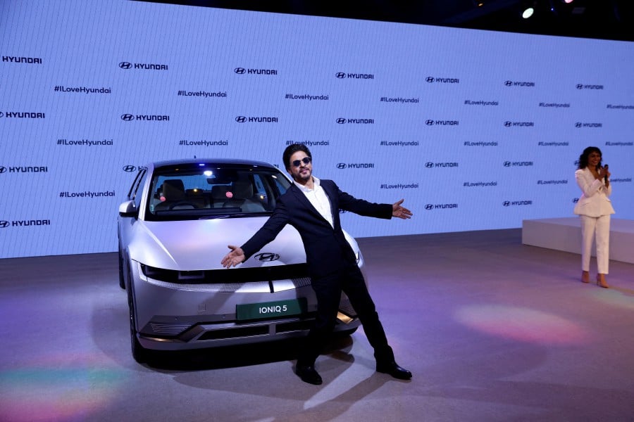 Bollywood actor Shahrukh Khan poses at the launch of Hyundai Ioniq 5 electric vehicle at the Auto Expo 2023 in Greater Noida, India.