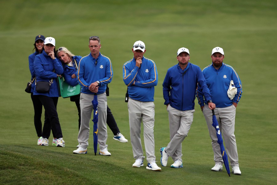 (R-L) Shane Lowry of Ireland, vice-captain Graeme McDowell of Northern Ireland, captain Padraig Harrington of Ireland and vice-captain Luke Donald of England and team Europe look on during Friday Afternoon Fourball Matches of the 43rd Ryder Cup at Whistling Straits on September 24, 2021 in Kohler, Wisconsin. - AFP PIC