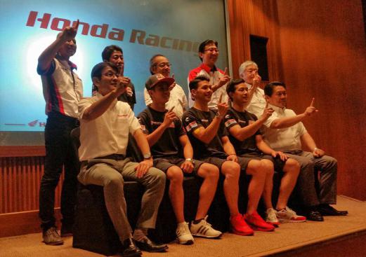 Honda racers Khairul Idham Pawi (second from left), Rattapark Wilairot (third from left) and Takaaki Nakagami (fourth from left) at the event.