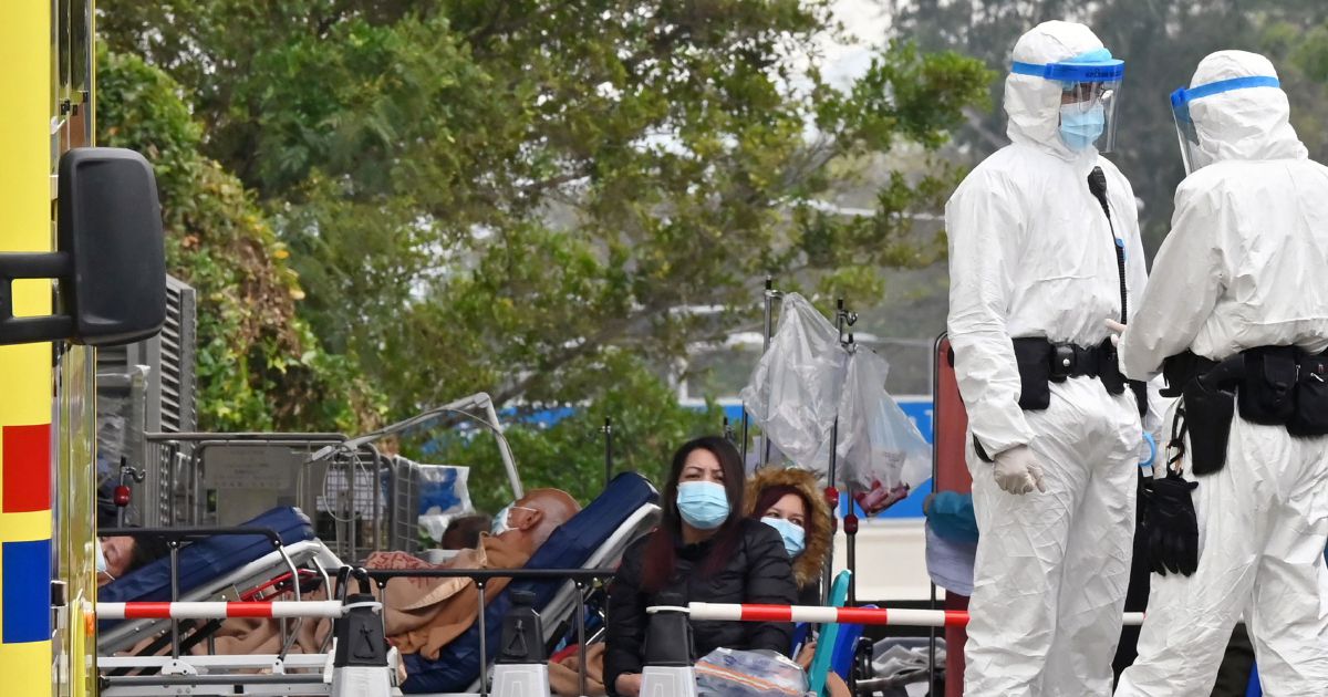 Hong Kong leader rules out China-style lockdown as virus spreads