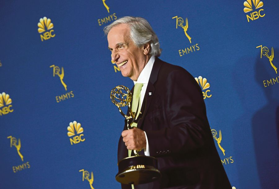 Supporting actor in a comedy series nominee Henry Winkler poses with his Emmy during the 70th Emmy Awards at the Microsoft Theatre in Los Angeles, California on Sept 17, 2018. AFP Photo
