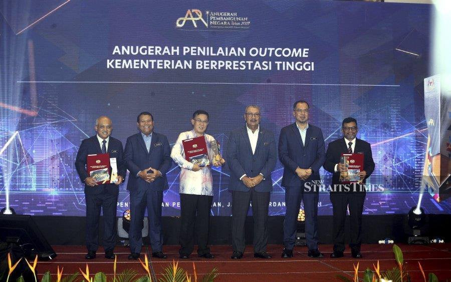 In his speech text read by the Prime Minister Department's Implementation Coordination Unit (ICU) director-general Datuk Seri Wan Ahmad Dahlan Abdul Aziz (3rd from right), Zuki said any decision has to be meticulous and precise to ensure smooth project executions. - NSTP/MOHD FADLI HAMZAH