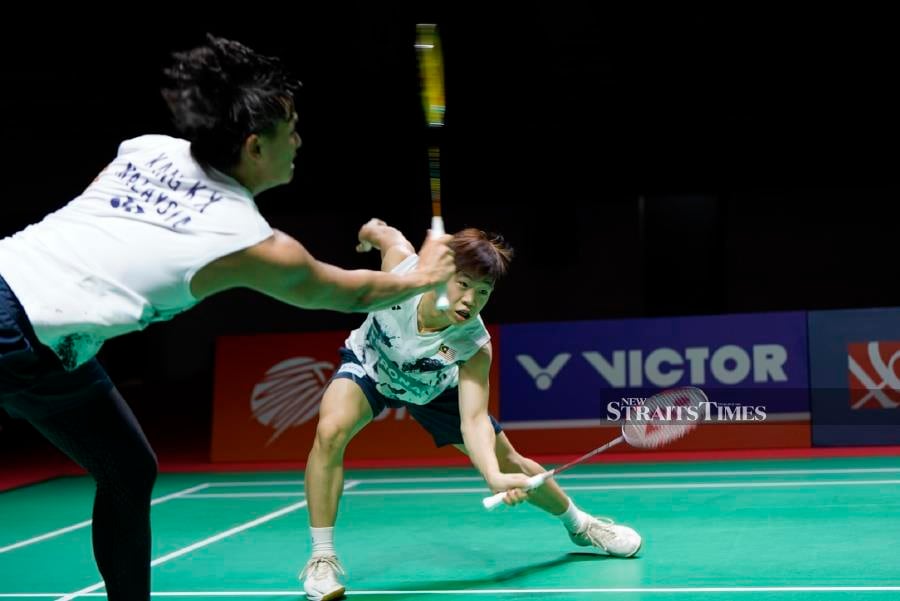 Malaysia’s Kang Khai Xing (left) -Aaron Tai in action against China during Monday’s mixed team semi-finals at the Badminton Asian Junior Championships in Yogyakarta, Indonesia.