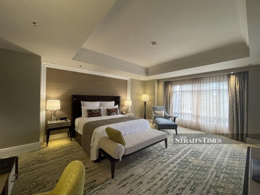 The spacious bedroom of Club Suite, tastefully furnished to give a lux vibe.