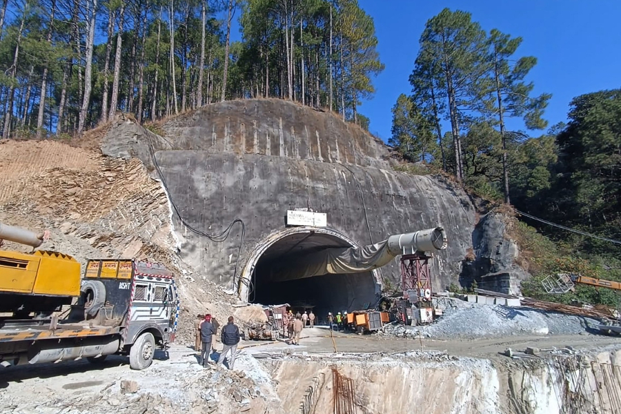 Excavators have been removing debris since Sunday morning from the site in the Himalayan state of Uttarakhand to create an escape tunnel for the 40 workers, who are all alive. (Photo by AFP)