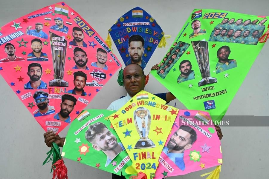 A kitemaker displays his kites decorated with pictures of Indian and South African cricket players in Amritsar on Friday, on the eve of the Twenty20 World Cup 2024 final. AFP PIC