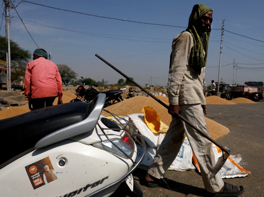 A sticker of India's Prime Minister Narendra Modi is pasted on a scooter at a wholesale grain market in Mathura, in the northern state of Uttar Pradesh, India, April 25, 2024. REUTERS