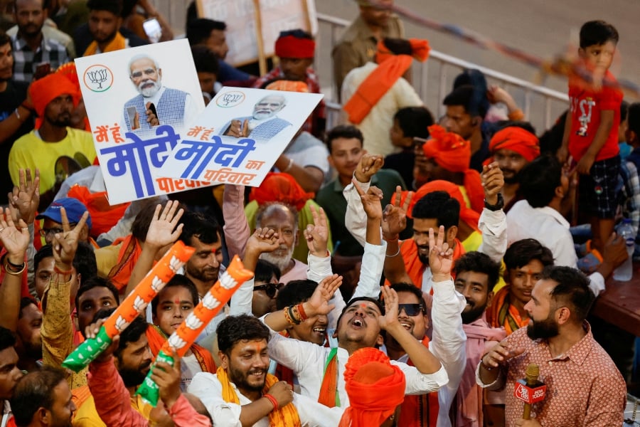 (FILE PHOTO) Supporters of India's Prime Minister Narendra Modi react, on the day of a Bharatiya Janata Party (BJP) election campaign rally in Ayodhya, India. (REUTERS/Francis Mascarenhas/File Photo)