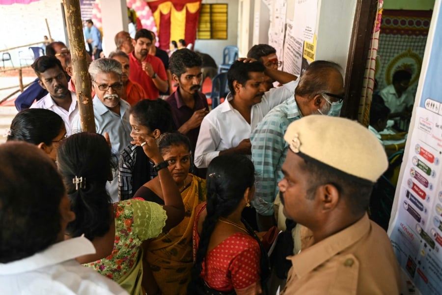 People wait to cast their vote at a polling station as voting starts in the first phase of India's general election in Chennai, capital of India's Tamil Nadu state on April 19, 2024. AFP PIC.