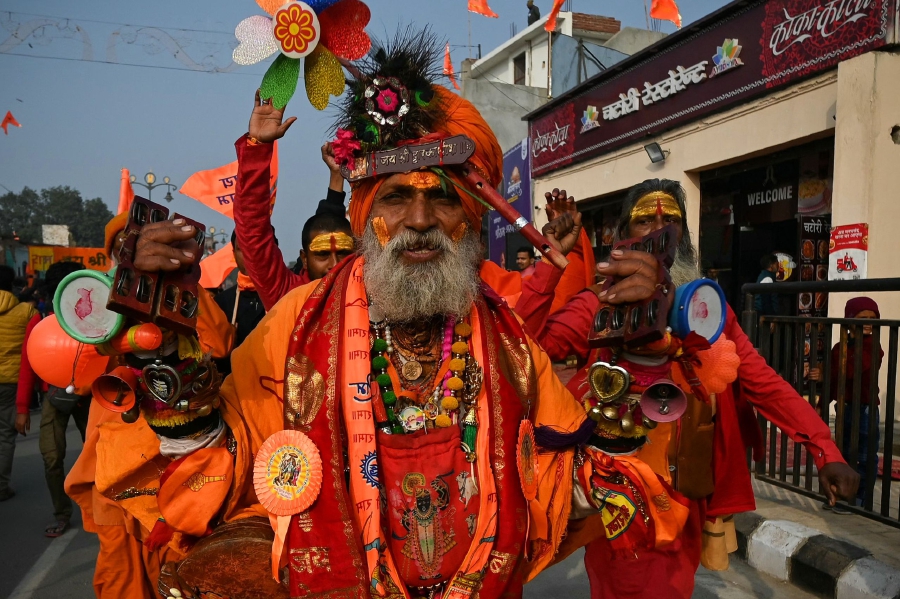 A Sadhu or an Indian holy man walks along a road in Ayodhya. (Photo by Money SHARMA / AFP)