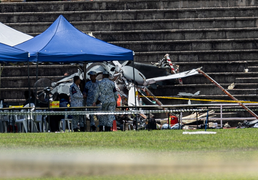 The bodies of the 10 victims involved in the mid-air collision and crash involving two helicopters at the Royal Malaysian Navy (RMN) base in Lumut were recovered earlier today. - BERNAMA pic