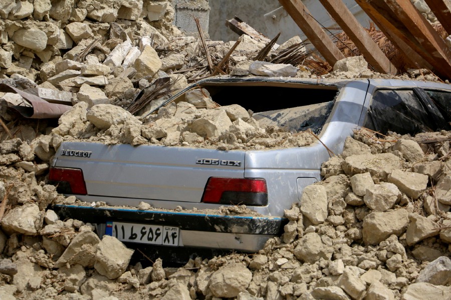 A car is seen under the rubble after an earthquake in Sayeh Khosh village in Hormozgan, Iran, July 2, 2022. - ISNA/WANA (West Asia News Agency) via REUTERS 