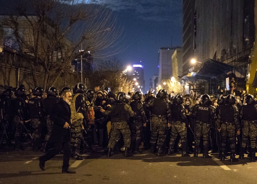 Iranian riot police stand guard as protesters gather in front of Tehran's Amir Kabir University on January 11, 2020. - Demonstrations broke out for a second night in a row after Iran admitted to having shot down a Ukrainian passenger jet by mistake on January 8, killing all 176 people on board. (Photo by - / AFP)