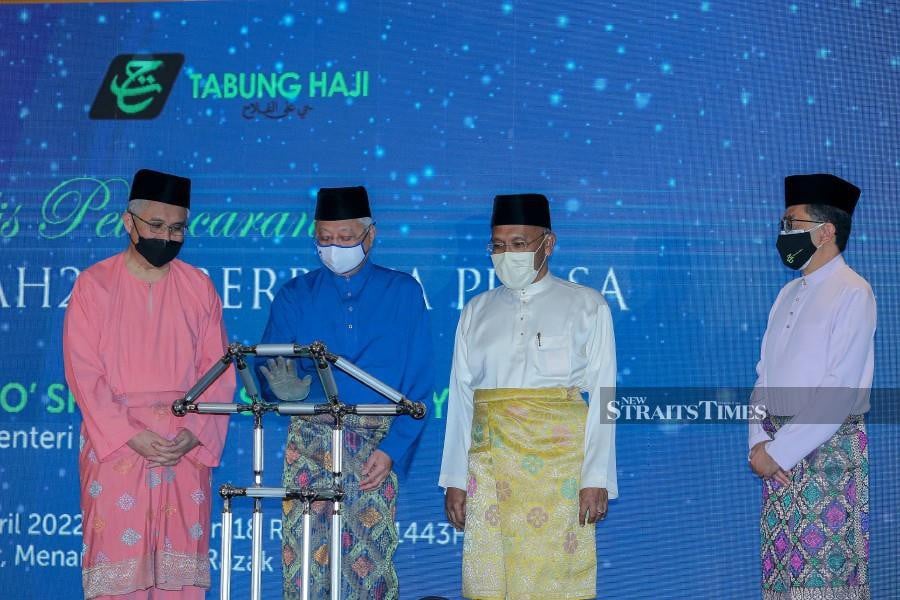 Prime Minister Datuk Seri Ismail Sabri Yaakob (2nd from left) said it will ensure continuity and excellence of the pilgrim’s fund on an ongoing basis.  - NSTP/ASYRAF HAMZAH