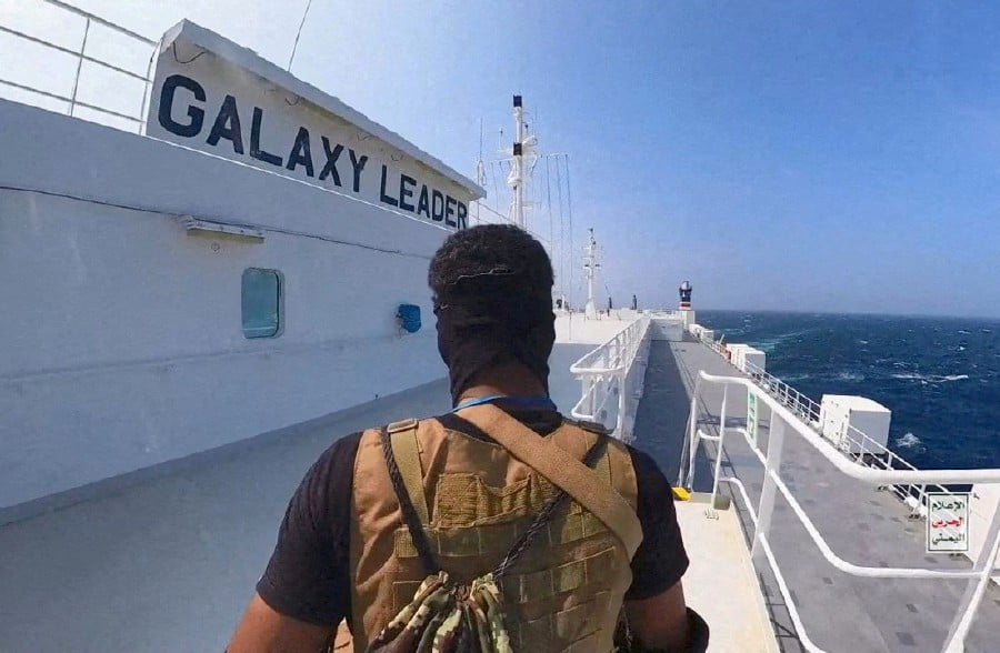 A Houthi fighter stands on the Galaxy Leader cargo ship in the Red Sea. REUTERS FILE PIC