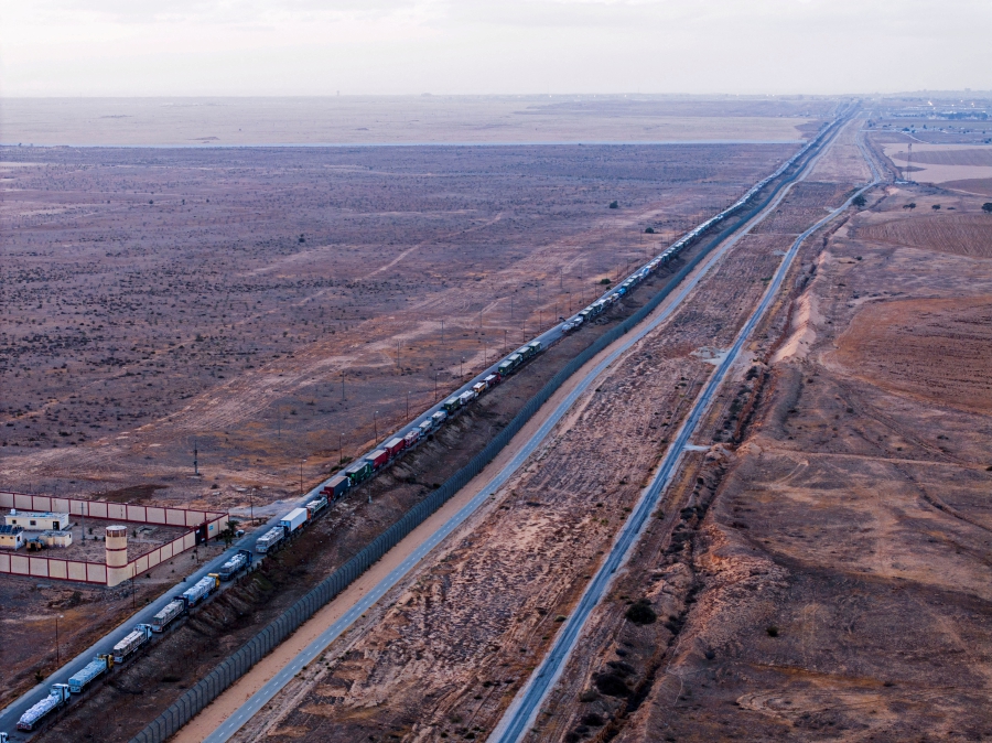 (FILE PHOTO) Trucks waiting on an Egyptian road along the border with Israel, near the Rafah border crossing with the Gaza Strip. (REUTERS/Oren Alon/File Photo)