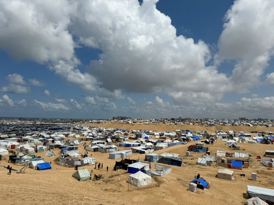 Palestinians, who fled their houses due to Israeli strikes, take shelter in a tent camp. (REUTERS/Mohammed Salem)