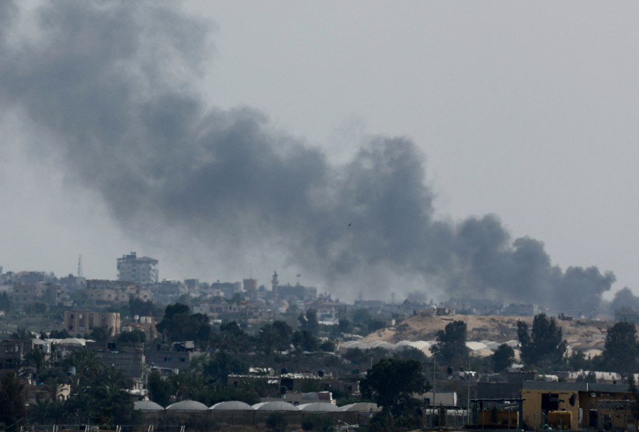 Smoke rises following Israeli strikes during an Israeli military operation in Rafah, as seen from Khan Younis, in the southern Gaza Strip, May 28, 2024. REUTERS