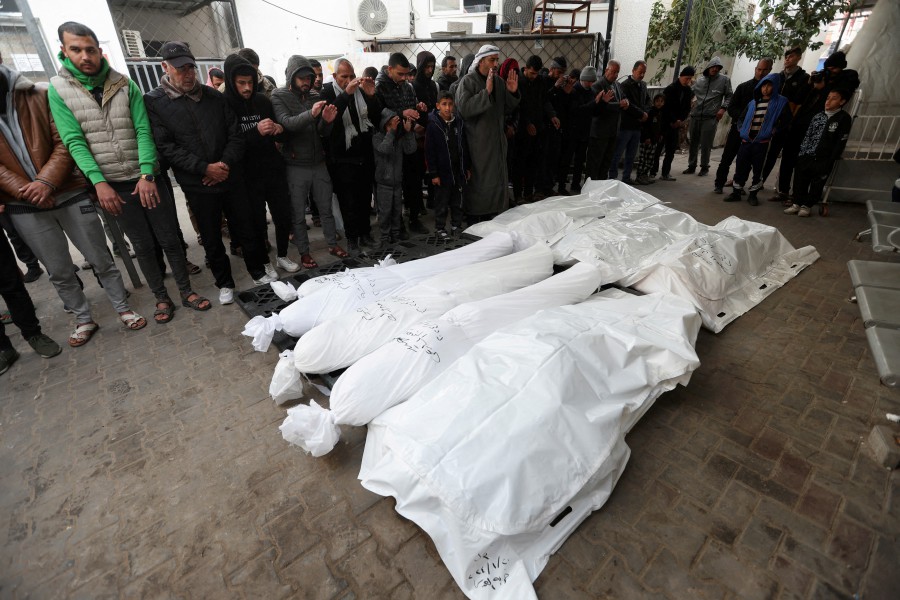 Mourners pray next to the dead bodies including four Palestinians killed in an Israeli strike on a car, amid the ongoing conflict between Israel and the Palestinian Islamist group Hamas, in Rafah in the southern Gaza Strip, January 21, 2024. REUTERS PIC