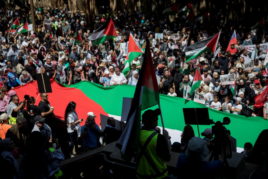 People demonstrate in support of Palestinians in Gaza as the conflict between Israel and Hamas continues, in Sydney, Australia, Saturday, October 21 2023. - AAP/Brent Lewin via REUTERS 