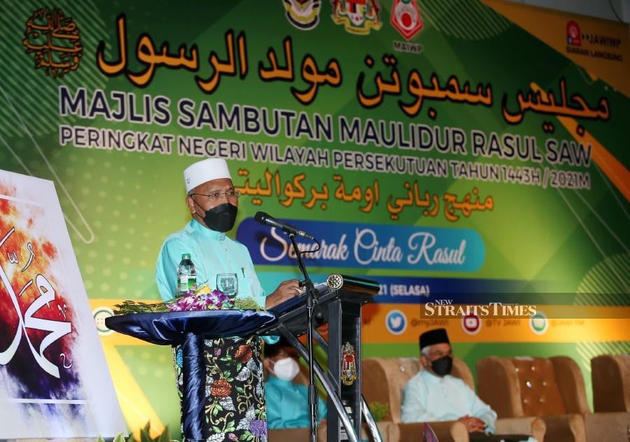 Minister in the Prime Minister’s Department (Religious Affairs) Senator Idris Ahmad delivers his speech during the 2021 Federal Territory State Level Maulidur Rasul Celebration at the Federal Territory Mosque. - NSTP/EIZAIRI SHAMSUDIN