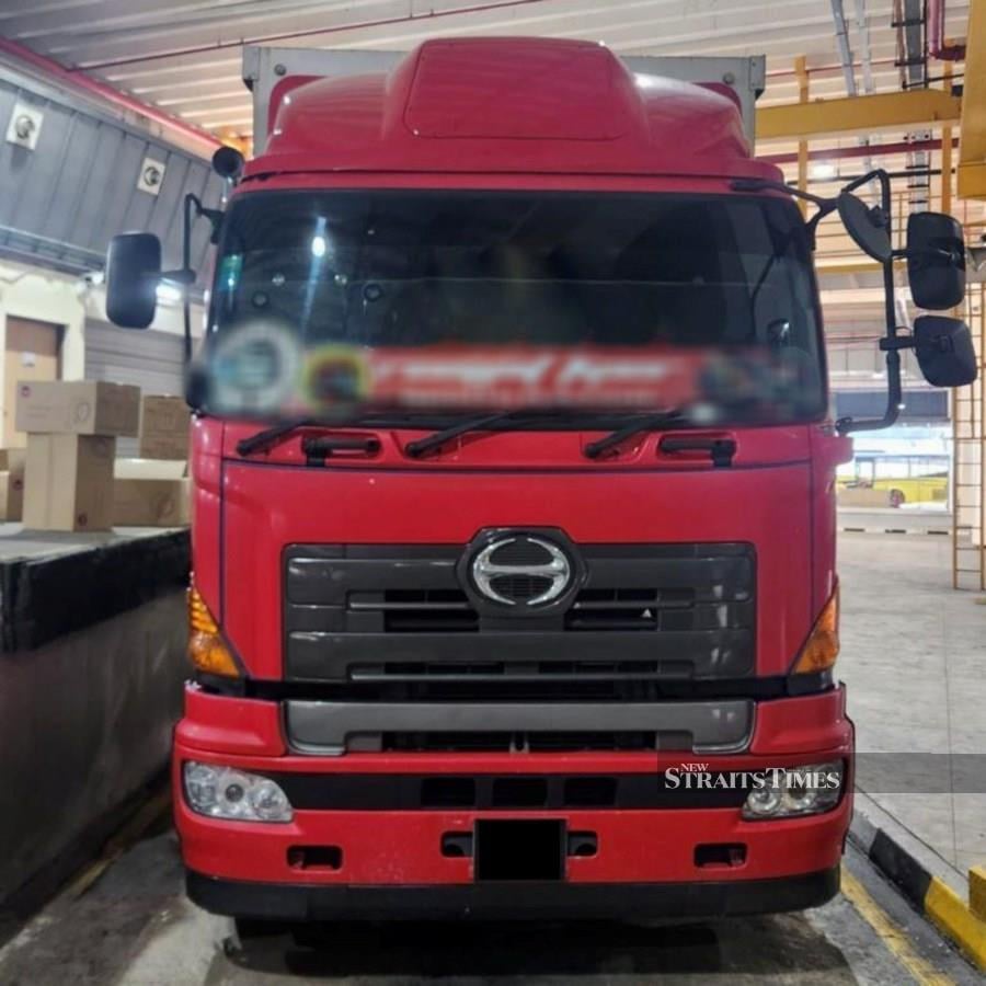 The illicit cigarettes were found concealed in the Malaysia-registered lorry at the Tuas Checkpoint. Picture courtesy of Immigration and Checkpoints Authority (ICA).