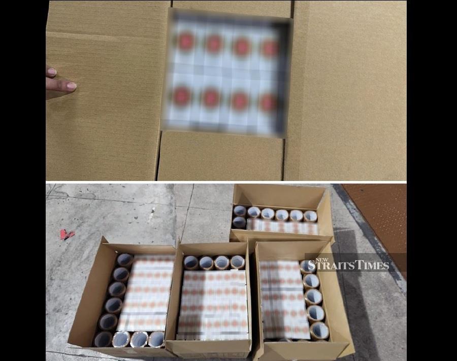 ICA's largest seizure of illicit cigarettes was found concealed in a Malaysia-registered lorry at the Tuas Checkpoint. Picture courtesy of Immigration and Checkpoints Authority (ICA).