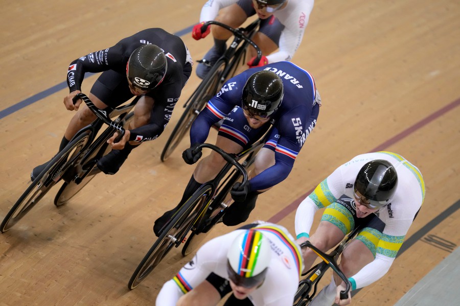 Vigier Sebastien of France, center, compete against Malaysia's Mohd Azizulhasni Awang, left, Austalia's Thomas Cornish, right, and Netherland's Harrie Lavreysen, bottom, during the men's keirin quarterfinals at UCI Track Nations Cup track cycling championship at Jakarta International Velodrome in Jakarta, Indonesia, Saturday, Feb. 25, 2023. -AP PIC