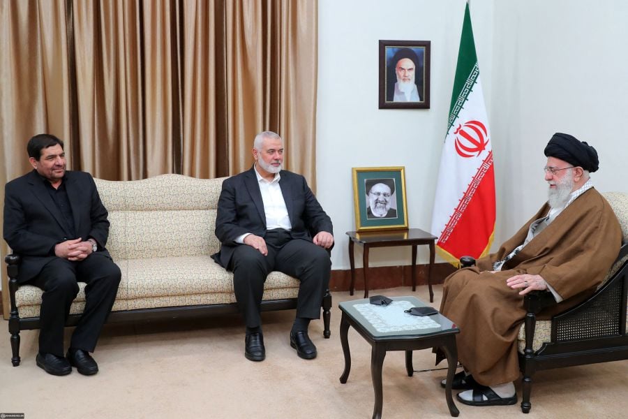 A handout picture provided by the office of Iran's Supreme Leader Ayatollah Ali Khamenei on May 22, shows him (Right) and vice president Mohammad Mokhber, acting as caretaker president (Left), meeting with the leader of Hamas, Ismail Haniyeh, in Tehran. Khamenei led prayers for late president Ebrahim Raisi on May 22, as huge crowds thronged the capital Tehran for his funeral procession. Raisi and his entourage died in a helicopter crash on May 20. — AFP