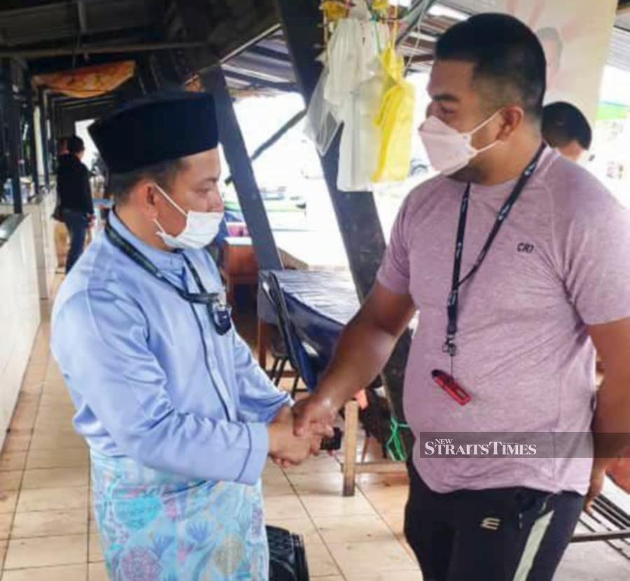Samarahan Bersatu division chief Ismawi Mohammad (left), from Kampung Baru, here, is one of the six candidates contesting the Muara Tuang seat. - NSTP/NORSYAZWANI NASRI
