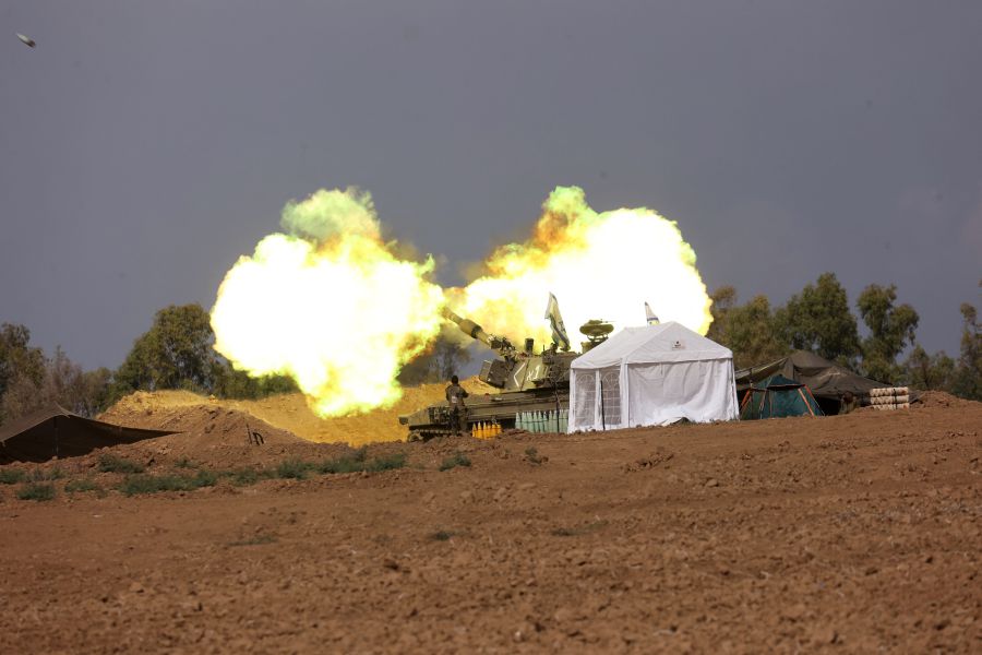 An Israeli artillery crew fires from a field near the border with the Gaza Strip on November 14, 2023, amid ongoing battles between Israel and the Palestinian group fighters Hamas. - AFP pic
