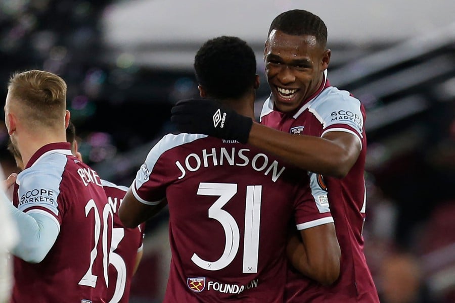 West Ham United's French defender Issa Diop (R) celebrates with teammates after scoring their second goal during the UEFA Europa League group H football match between West Ham United and Genk at The London Stadium, in east London. - AFP PIC