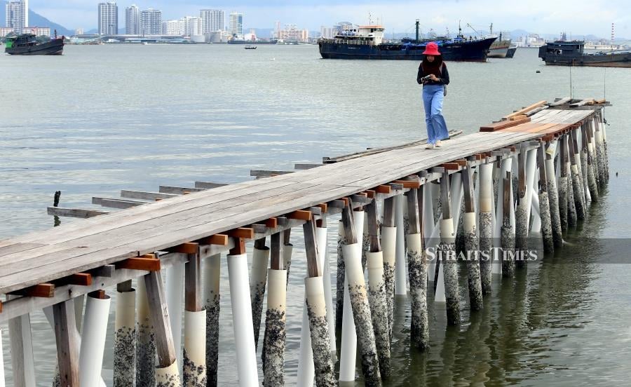 The Tan Jetty, one of the seven remaining Chinese clan jetties off Weld Quay here, will get its decaying boardwalks replaced, thanks to the chief minister’s parliamentary grant of RM175,035. - NSTP/DANIAL SAAD