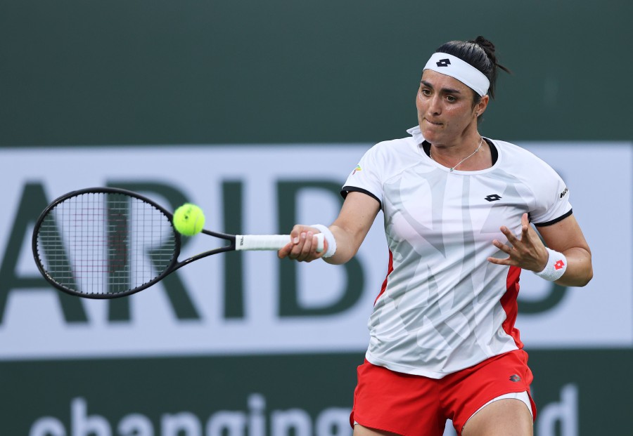 Ons Jabeur of Tunisia plays a forehand against Anett Kontaveit of Estonia during their quarterfinal match on Day 11 of the BNP Paribas Open at the Indian Wells Tennis Garden on October 14, 2021 in Indian Wells, California. - AFP PIC