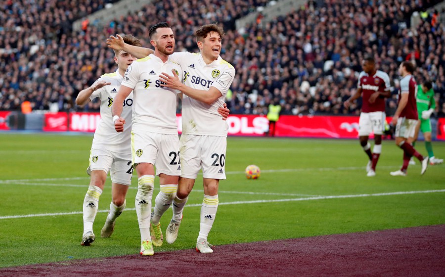 Leeds United's Jack Harrison celebrates scoring their third goal and his hat-trick with Daniel James (right) during the match against West Ham United at the London Stadium, London. - REUTERS