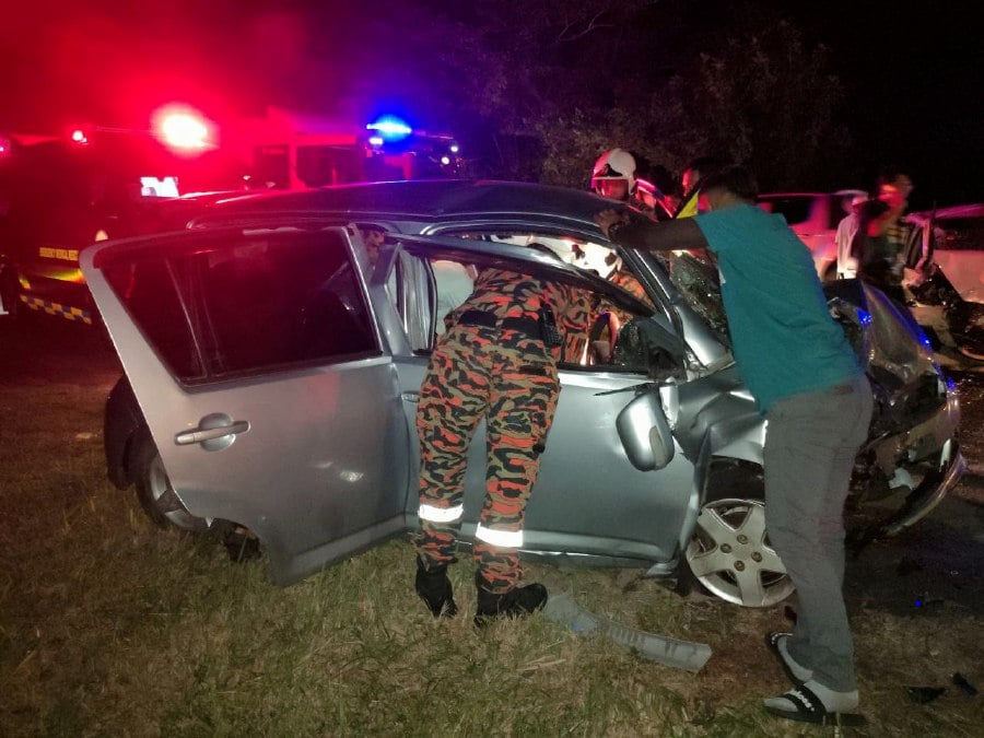 The three were injured after the car they were in was involved in an accident with three vehicles on at Jalan Batu 8, here today. - Pic courtesy of Fire and Rescue Dept