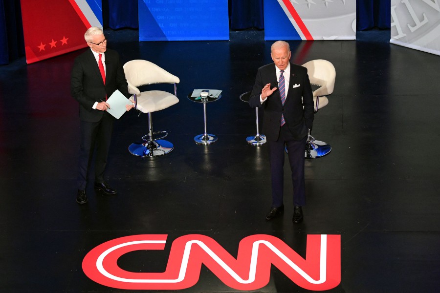 US President Joe Biden participates in a CNN town hall hosted by anchor Anderson Cooper (L) at Baltimore Center Stage in Baltimore, Maryland. - AFP PIC