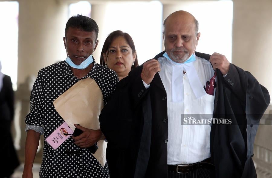 Among those who were relieved by the sentence was Datuk Richard Morais (left), the elder brother of the murdered deputy public prosecutor (DPP); and his fellow comrades present during the proceedings. - NSTP/HAIRUL ANUAR RAHIM