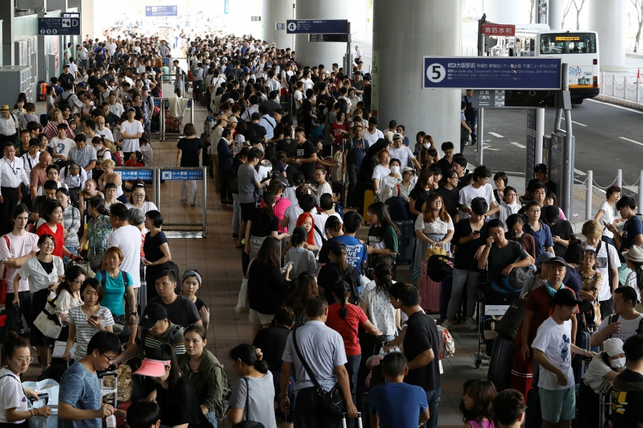 Japan evacuates major airport after typhoon wreaks havoc | New Straits ...