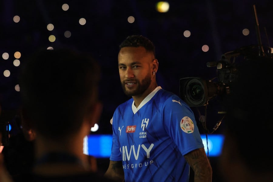 Brazilian superstar Neymar enters the pitch during his unveiling ceremony at Al-Hilal in Riyadh on August 19, 2023 as he becomes the latest world-famous footballer snapped up by the big-spending Saudi Pro League. - AFP pic