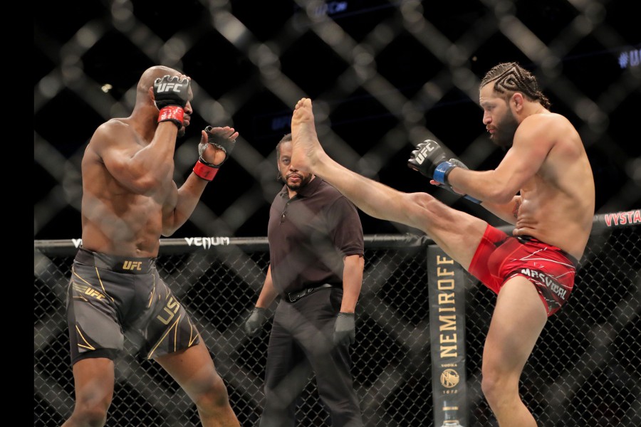  Jorge Masvidal attempts to kick Kamaru Usman (left). - AFP pic