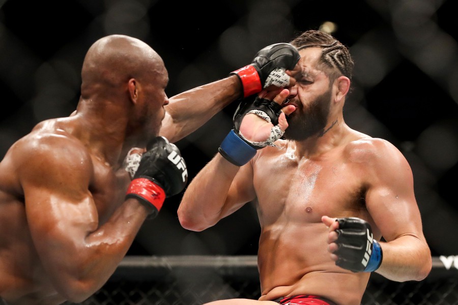  Kamaru Usman (left) punches Jorge Masvidal during the Welterweight Title bout of UFC 261 at VyStar Veterans Memorial Arena in Jacksonville, Florida. - AFP pic