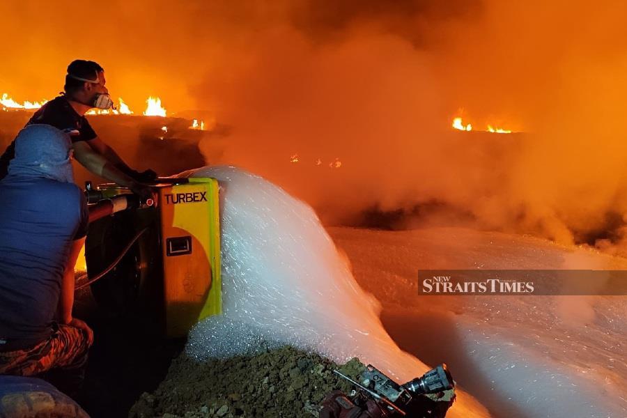 A fire at the Kayu Madang landfill site in Telipok has been burning for four days with no signs of being extinguished. - Pic courtesy of Fire and Rescue Dept