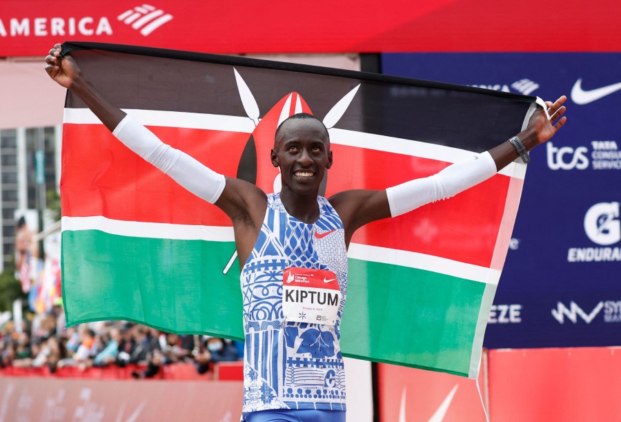 Kenya's Kelvin Kiptum celebrates winning the 2023 Bank of America Chicago Marathon in Chicago, Illinois, in a world record time of two hours and 35 seconds on October 8, 2023. - APF PIC