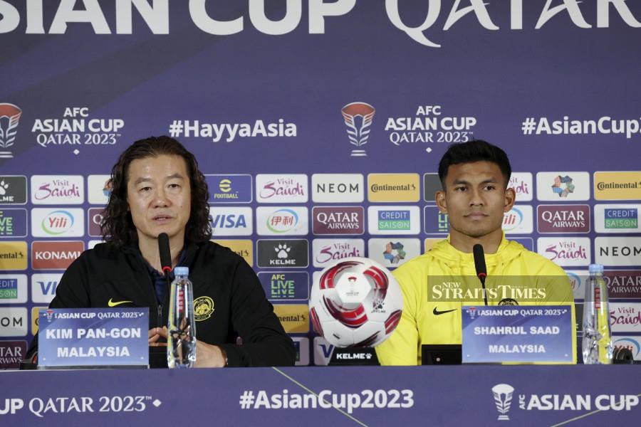 The head coach of Malaysia, Kim Pan Gon, along with player Shahrul Saad during a press conference ahead of the match against Bahrain in Group E stage of the 2023 Asian Cup at the Main Media Center (MPC), Doha. NSTP/HAIRUL ANUAR RAHIM