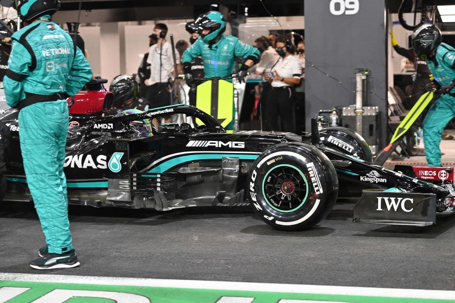 Mechanics work on the car of Mercedes' British driver Lewis Hamilton in the pits during a stop in the session the Formula One Saudi Arabian Grand Prix at the Jeddah Corniche Circuit in Jeddah on December 5, 2021. - AFP pic